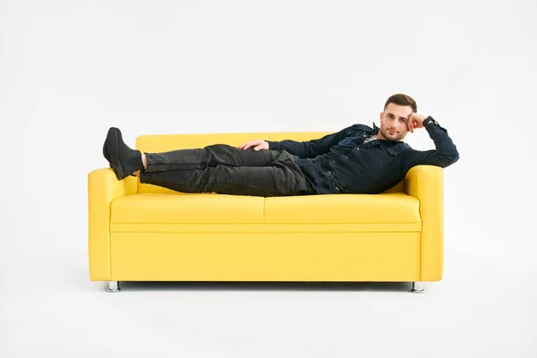 Young Man Relaxing Alone Yellow Sofa Home Rest Concept — Stock Photo, Image