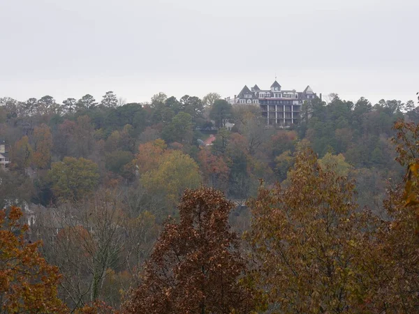 Colorful treetops with the famous Crescent Hotel in the distance.