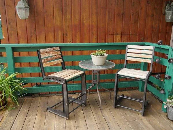 Outdoor chairs and wooden floors in a hotel balcony
