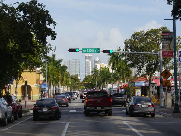 Miami, Florida- December 2018: Medium wide shot of traffic building up on a three-lane, one way road in Miami.