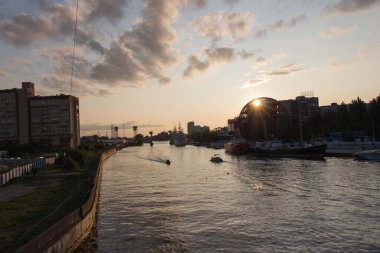 Kaliningrad, Russia - August 02 2019: the view of ships at pier of Pregolya River near World Ocean Museum at sunset light on August 02 2019 in Kaliningrad, Russia.