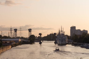 Kaliningrad, Russia - August 02 2019: the view of ships at pier of Pregolya River near World Ocean Museum at sunset light on August 02 2019 in Kaliningrad, Russia.