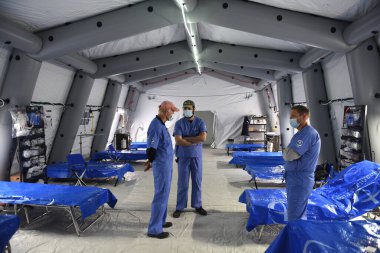 Lviv, Ukraine - March 14, 2022: Field hospital deployed by Christian disaster relief NGO Samaritan's Purse in an underground parking lot of the shopping mall near city of Lviv. clipart