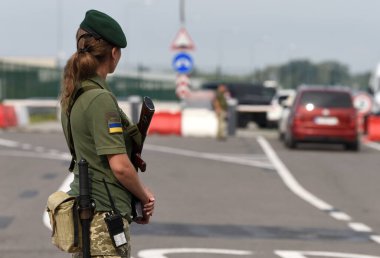 Krakivets, Ukraine - August 16, 2022: Border Guard on Krakivets-Korczowa checkpoint on the border with Ukraine and Poland, some 70 km from city of Lviv, Ukraine. 