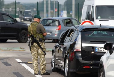 Krakivets, Ukraine - August 16, 2022: Border Guard on Krakivets-Korczowa checkpoint on the border with Ukraine and Poland, some 70 km from city of Lviv, Ukraine. 