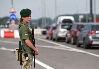 Krakivets, Ukraine - August 16, 2022: Border Guard on Krakivets-Korczowa checkpoint on the border with Ukraine and Poland, some 70 km from city of Lviv, Ukraine. 