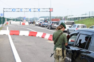 Krakivets, Ukraine - August 16, 2022: Border Guard on Krakivets-Korczowa checkpoint on the border with Ukraine and Poland, some 70 km from city of Lviv, Ukraine. 