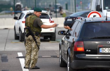 Krakivets, Ukraine - August 16, 2022: Border Guard on Krakivets-Korczowa checkpoint on the border with Ukraine and Poland, some 70 km from city of Lviv, Ukraine. 