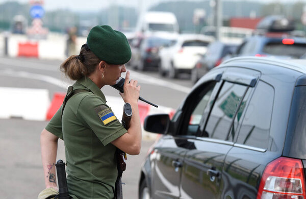 Krakivets, Ukraine - August 16, 2022: Border Guard on Krakivets-Korczowa checkpoint on the border with Ukraine and Poland, some 70 km from city of Lviv, Ukraine. 