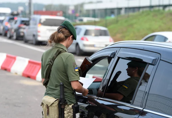 Krakivets, Ukraine - August 16, 2022: Border Guard on Krakivets-Korczowa checkpoint on the border with Ukraine and Poland, some 70 km from city of Lviv, Ukraine. 
