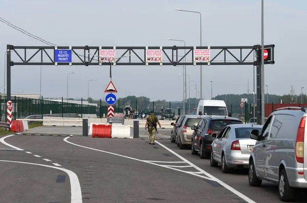 Krakivets, Ukraine - August 16, 2022: Border Guard on Krakivets-Korczowa checkpoint on the border with Ukraine and Poland, some 70 km from city of Lviv, Ukraine. 