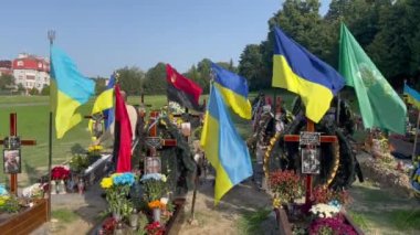 Lviv, Ukraine - August 24, 2022: Graves of fallen Ukrainian soldiers killed during the Russian invasion of Ukraine.