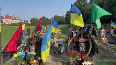 Lviv, Ukraine - August 24, 2022: Graves of fallen Ukrainian soldiers killed during the Russian invasion of Ukraine.