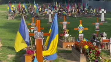 Lviv, Ukraine - August 24, 2022: Graves of fallen Ukrainian soldiers killed during the Russian invasion of Ukraine.