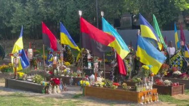 Lviv, Ukraine - August 24, 2022: Graves of fallen Ukrainian soldiers killed during the Russian invasion of Ukraine.