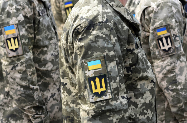 Armed Forces of Ukraine. Ukrainian soldier. Ukrainian army. Ukrainian flag on military uniform. 