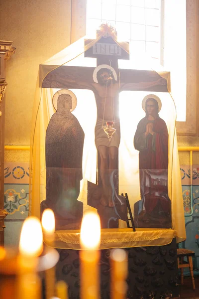 Religion altar with crucifixion of Jesus in the light from a huge window in the church. Window with light in the church.