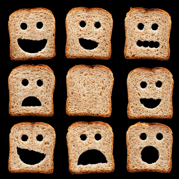 Fatias de pão com expressões faciais — Fotografia de Stock
