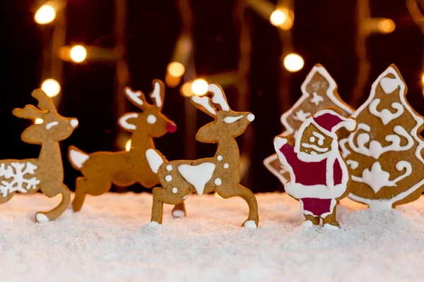 Christmas setting - gingerbread deers and santa — Stock Photo, Image