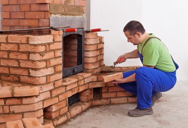 Worker building masonry heater clipart