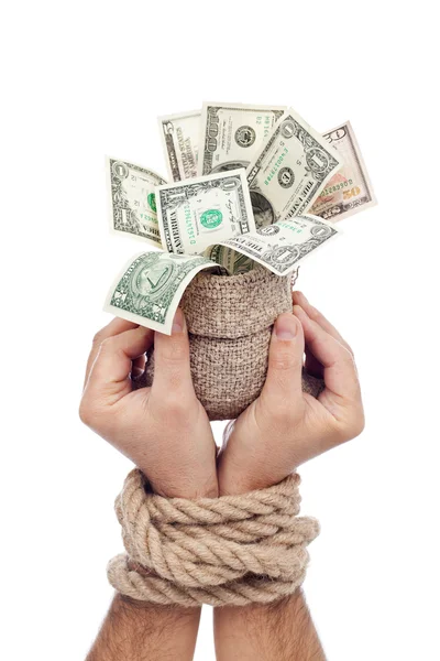 Prisoner of profit - man holding bag of money — Stock Photo, Image