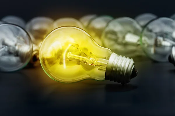 Idea concept with incandescent light bulbs — Stock Photo, Image