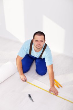 Laying laminate flooring - the insulation layer clipart