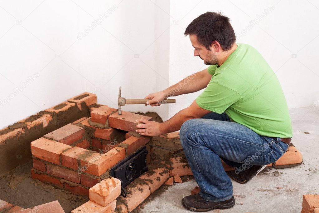 Man building fireplace