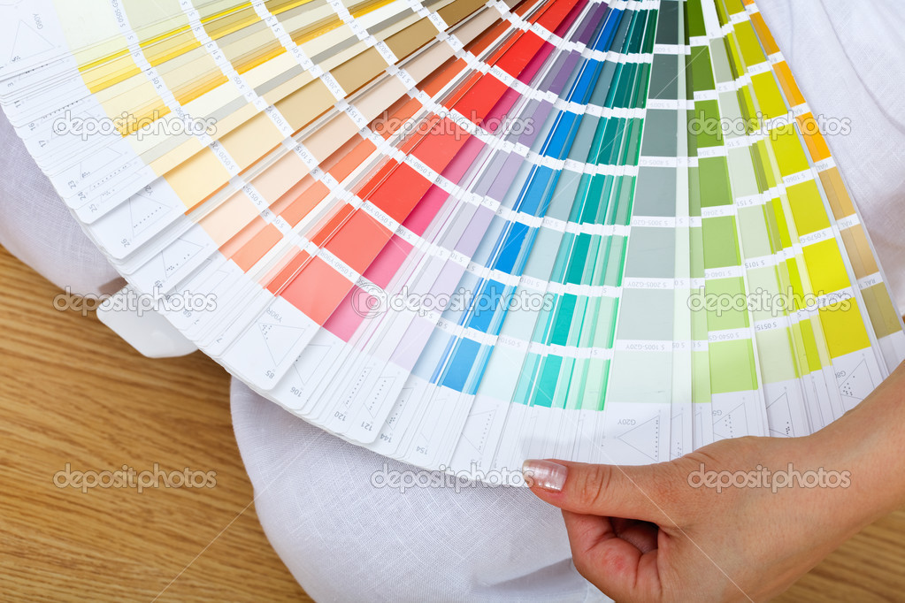 Woman hand with color chart