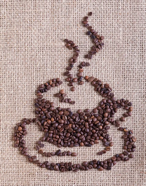 咖啡杯子做的豆子-麻布背景上 — 图库照片