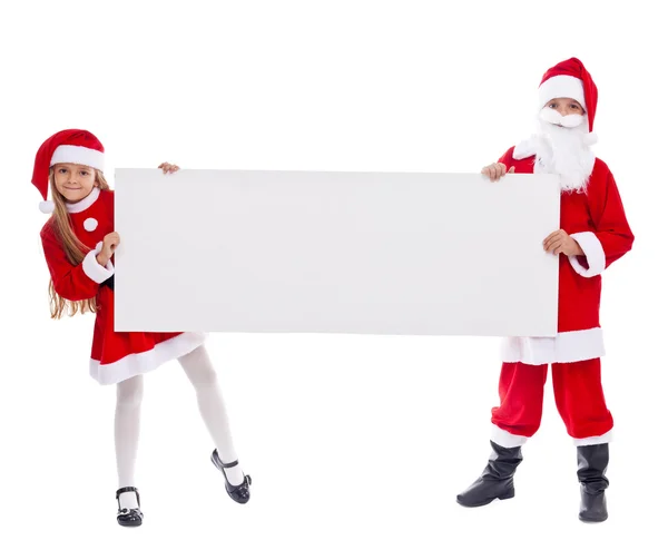 Santa och hjälpare visar tomma tecken — Stockfoto