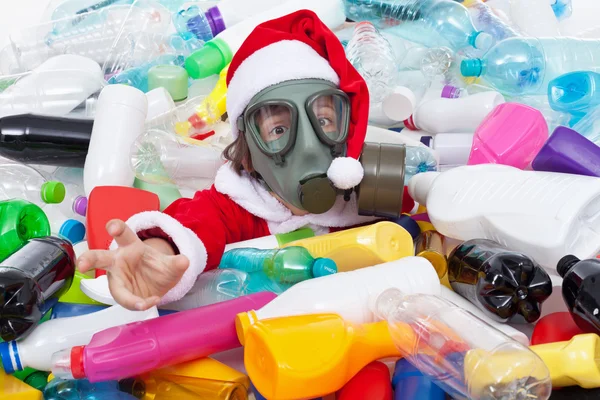 Toxic christmas - santa drowning in plastic bottles — Stock Photo, Image