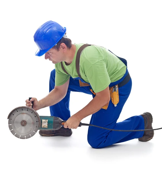 Worker with a power grinder — Stock Photo, Image