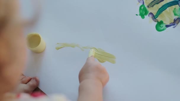 Child Draw Yellow Paint Baby Drawing Finger Drawing Large Sheet — Stockvideo