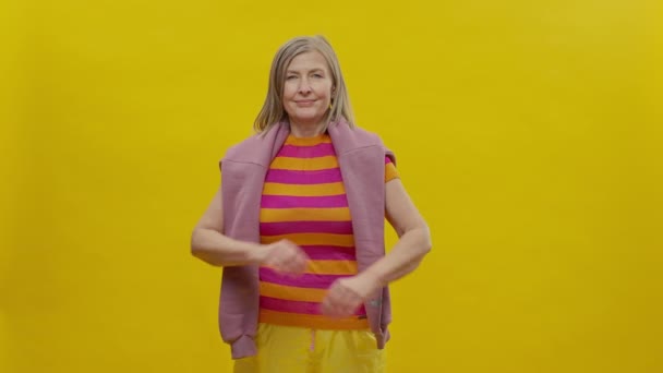 Elderly Woman Sportswear Yellow Background She Cheerful Woman Has Sweater — Stockvideo