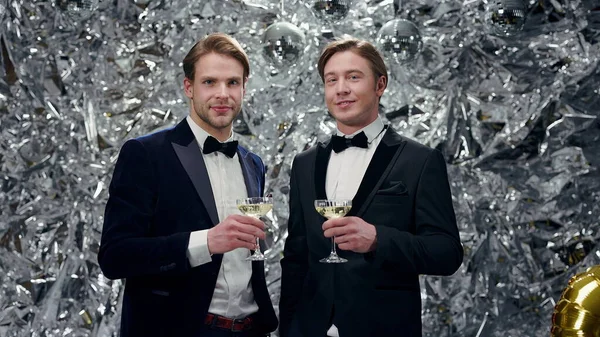 Two Young Men Shiny Background Glasses Champagne Cute Men Suits – stockfoto
