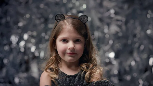 Funny Cheerful Little Girl Stands Shiny Background Celebration Little Girl — kuvapankkivalokuva