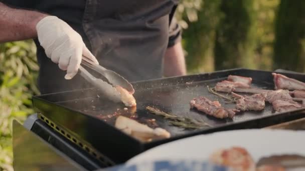 Man Gloves Apron Turns Meat Barbecue Takes Piece Roast Meat — Stockvideo