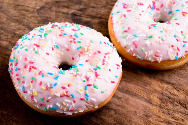 Donut with colorful sprinkles — Stock Photo, Image