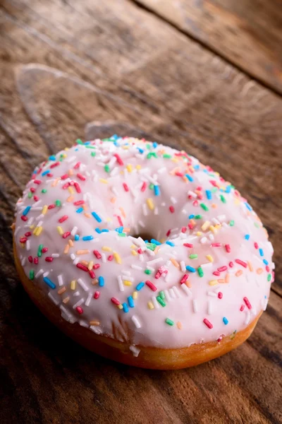 Donut with colorful sprinkles — Stock Photo, Image
