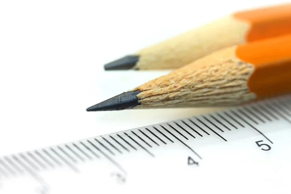 Pencils and scale — Stock Photo, Image