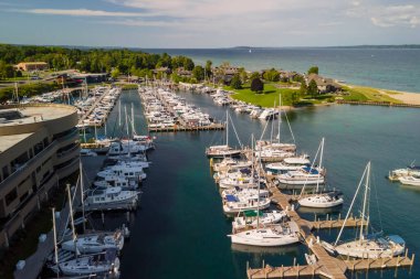 Aerial view of Traverse city marina in Michigan with several boats docked clipart