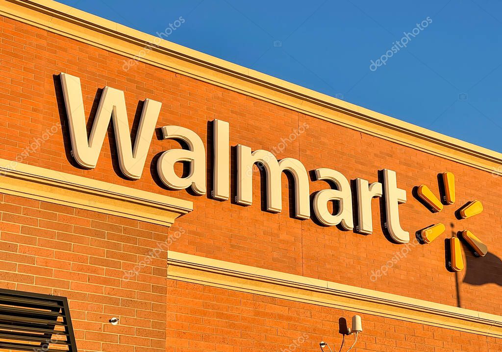 Novi, Michigan, USA - AUGUST 8, 2021: Walmart sign at store exterior. Walmart is an American large retail corporation operates discount stores across the world.