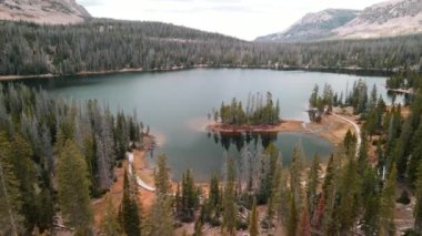 Scenic Mirror lake  landscape in Uinta Wasatch cache national forest surrounded with Coniferous trees.