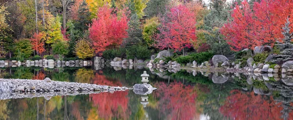 Rock lantern in the middle of lake in Japanese garden inside Frederik Meijer's garden, Grand Rapids, Michigan.