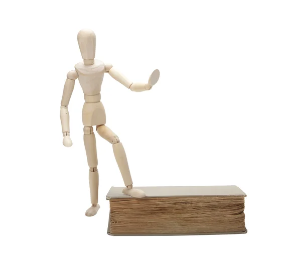Wooden man and book — Stock Photo, Image