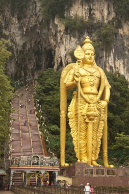 Statue of lord Muragan outside the Batu caves. clipart