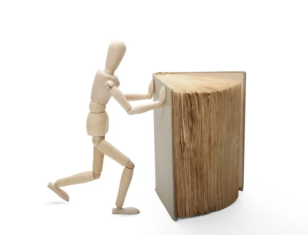Hombre y libro de madera — Foto de Stock