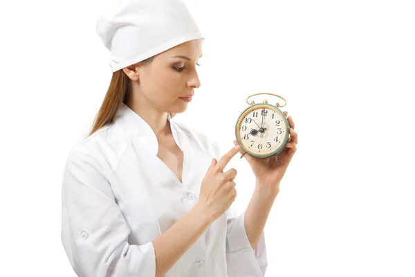 Médico femenino con reloj despertador, aislado — Foto de Stock