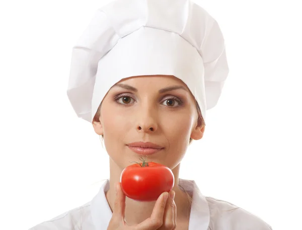 Mujer sonriente cocinera con tomate rojo —  Fotos de Stock